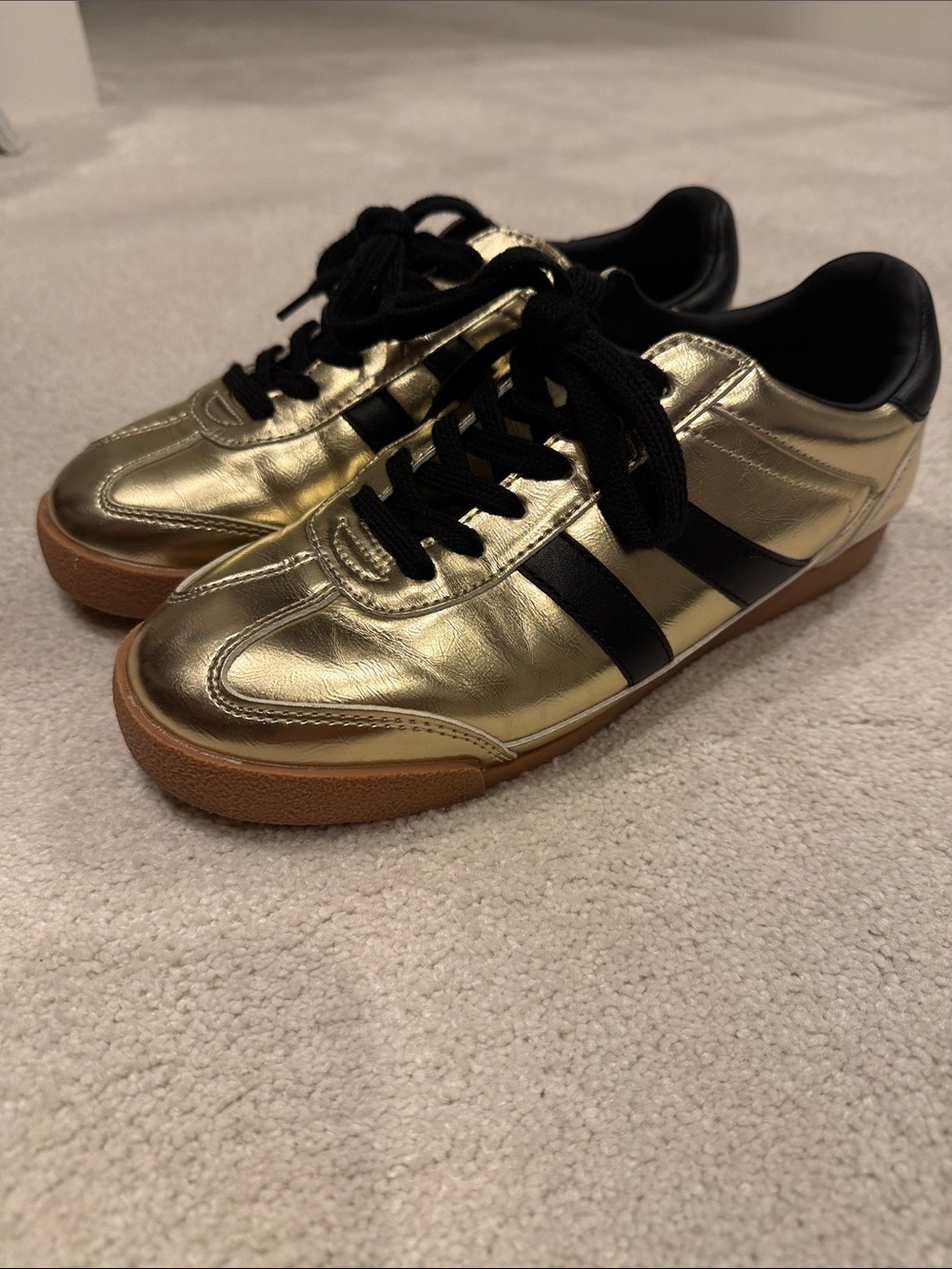 Steve Madden Women’s Gold Sneakers with Black Stripes